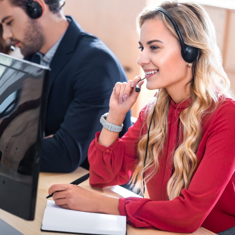 selective-focus-of-smiling-call-center-operator-working-in-office-e1640064401265